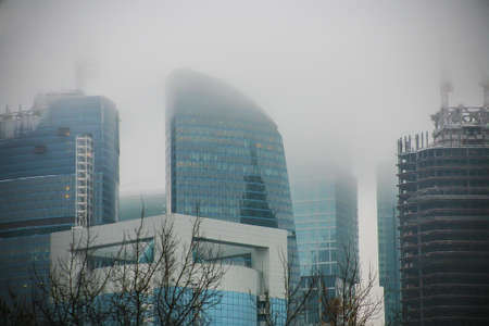 skyscrapers complex of Moscow - City in the fog in winterの写真素材