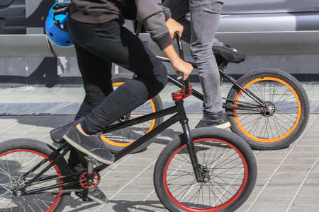 two cyclists on sports bikes close-upの写真素材