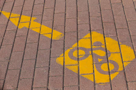bicycle symbol drawn with paint on sidewalkの写真素材