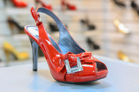 Women's luxury red shoes on counter shoe storeの写真素材