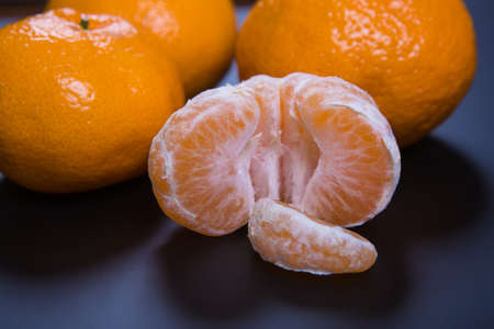 Tangerines on black background close-upの写真素材