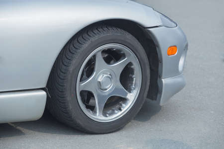 modern silvery sports car on roadの写真素材
