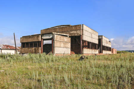Abandoned factory - concrete ruins in industrial districtの写真素材