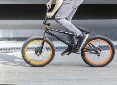 cyclist jump on bicycle closeup detailの写真素材