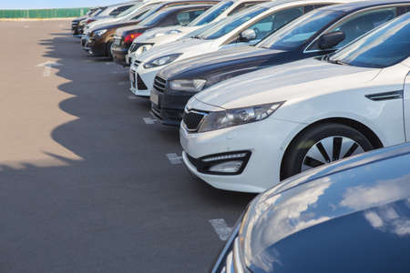 number of cars on the outside in the parking lotの写真素材
