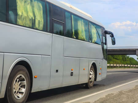 tourist bus goes on highway  in countryの写真素材