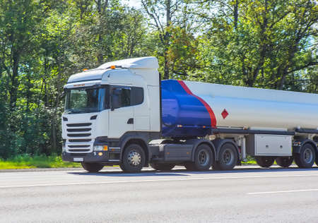 big gas-tank truck goes on highwayのeditorial素材