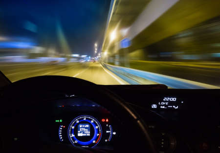 view from moving car on highway at nightの写真素材