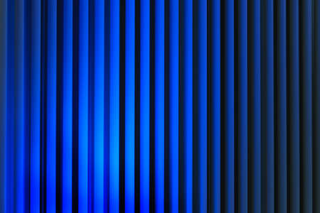 Vertical blue lines in gradient illumination abstract backgroundの写真素材
