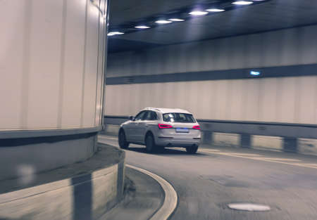 car moves in the lit tunnel on turning movement