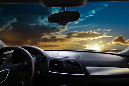 sunset from the interior of a modern carの写真素材