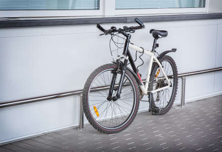 modern bicycle near the wall close-upの写真素材