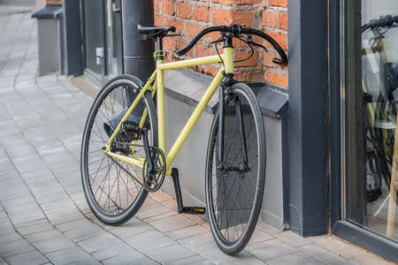 modern bicycle near the wall close-upの写真素材