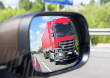 red truck reflection in a car mirrorの写真素材