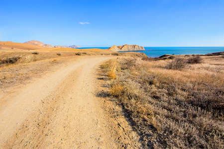 Beautiful view of road, sea, mountains and skyの写真素材