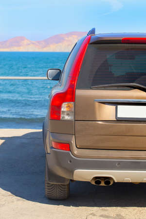 Car on the sea promenade on a sunny summer dayの写真素材