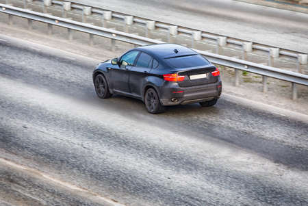 Car modern black on the multiband highway