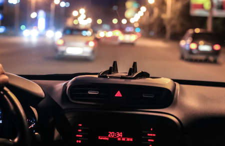 view from moving car on highway at night