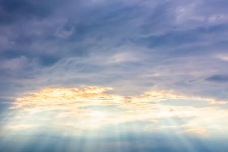 Beautiful dark sky with sunlight and clouds