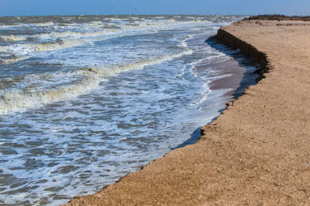 Steep sea bank. Huge waves.の写真素材