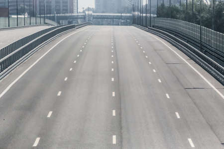 Car bridge with multi-lane highway in a big city.の写真素材