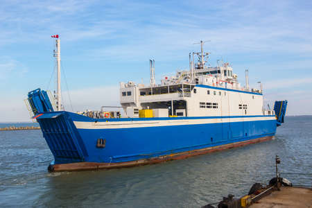 Sea ferry leaves for the sea from the pier.のeditorial素材
