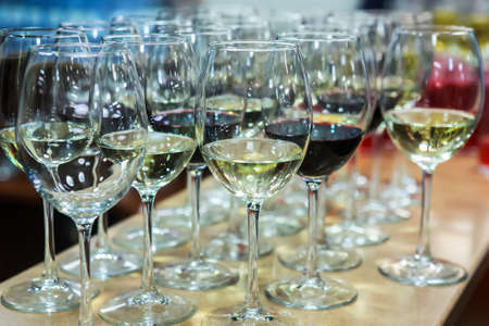 Lot of glasses with champagne and red wine. Close-upの写真素材