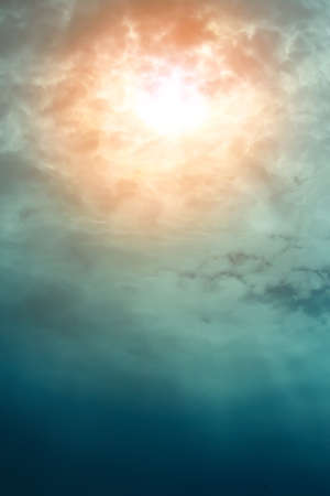 Beautiful dark sky with sun and cloudの写真素材