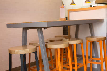 Bar table and chairs in the interior of the cafe