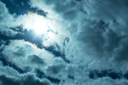Beautiful Dark Sky with Sun and Clouds