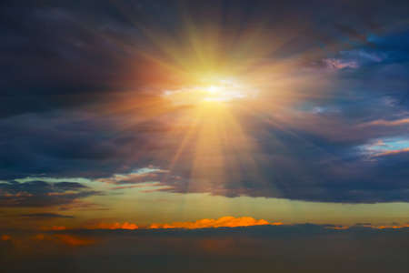 Beautiful dark sky with sun and cloudの写真素材