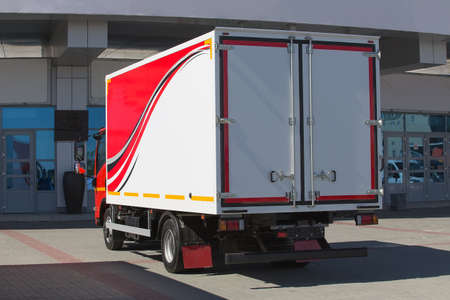 truck with container near building facadeの写真素材