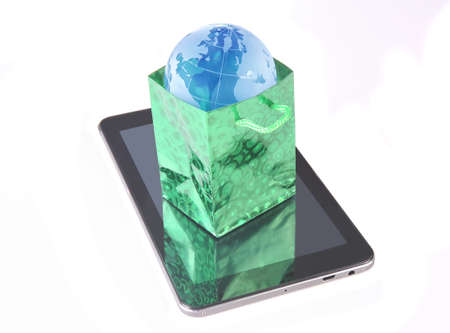 Globe in a package on a tablet computer. E-commerce, concept.の写真素材