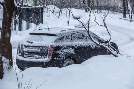cars in the Parking lot in the winter under the snowの写真素材