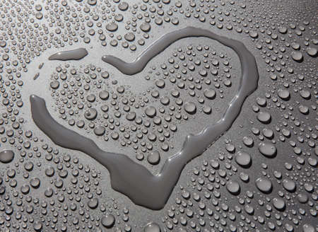 symbol of heart water and drops on grey backgroundの写真素材