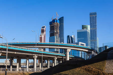 modern business centre and car bridges in the city centreの写真素材