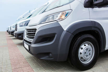 number of new white minibuses and vans outsideの写真素材