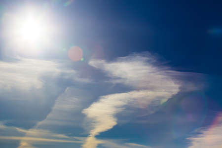 Beautiful Dark Sky with Sun and Cloudsの写真素材