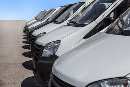 number of new white minibuses and vans outsideの写真素材