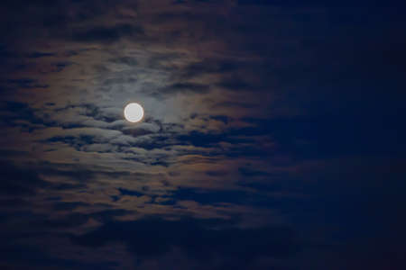 Mysterious night sky with moon and clouds. Moonlight. Background.の写真素材
