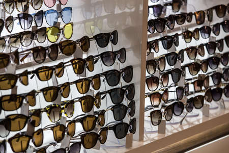 Display of modern colorful sunglasses for sale in a street.の写真素材