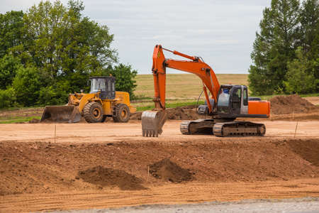 road construction equipment and construction of suburban highwayの写真素材