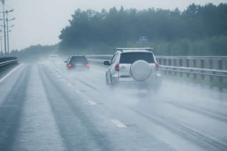 car traffic on highway during pouring rainの写真素材