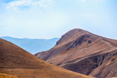 beautiful mountain landscape with blue cloudy skyの写真素材