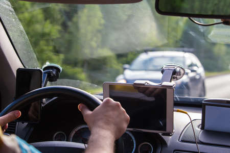 Driver in the car controls the navigator.