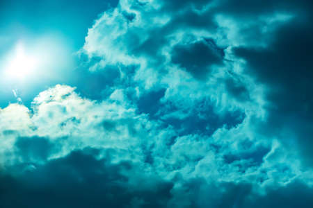 Beautiful Dark Sky with Sun and Cloudsの写真素材