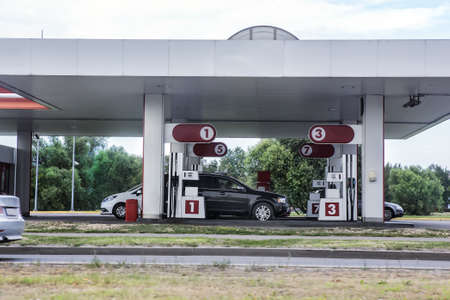 cars are refueled with gasoline at the petrol stationのeditorial素材