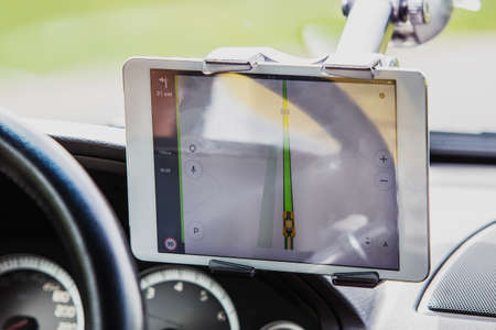 Driver in the car controls the navigator. Close-up part