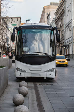 Big tourist bus on the street in the city. Front view.の写真素材