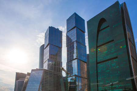 Beautiful view of futuristic city landscape. Glass facades of skyscrapers in city center. Bottom...